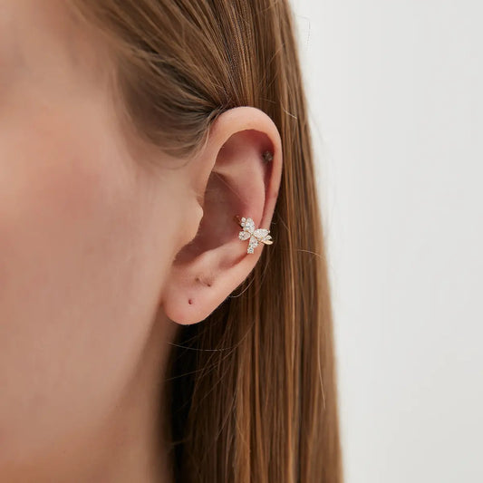 Close-up view of the 18K solid gold Butterfly Diamond Ear Cuff, showcasing its delicate butterfly-inspired silhouette and total 0.40ct lab-grown white diamonds. The luminous diamonds and sculptural form create a refined combination of nature-inspired design and contemporary fine jewelry.