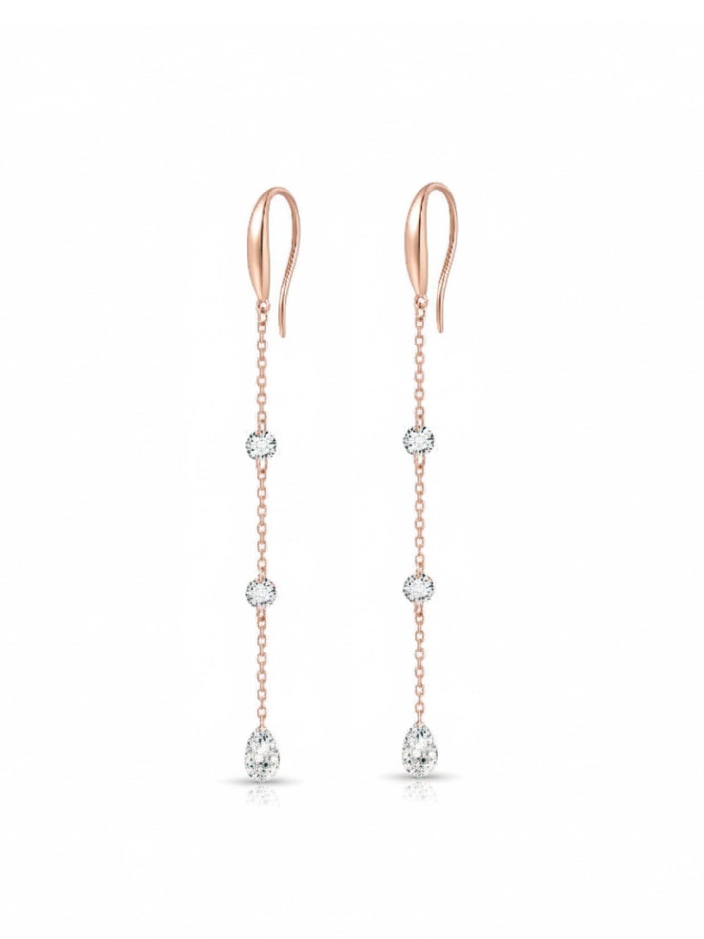 A high-resolution photo of the Triple Diamond Chain Dangle Hoop from LTM Jewels. Showcases 0.40ctw of round and pear diamonds on an 18K solid gold chain, emphasizing its vertical raindrop effect and cinematic sparkle.