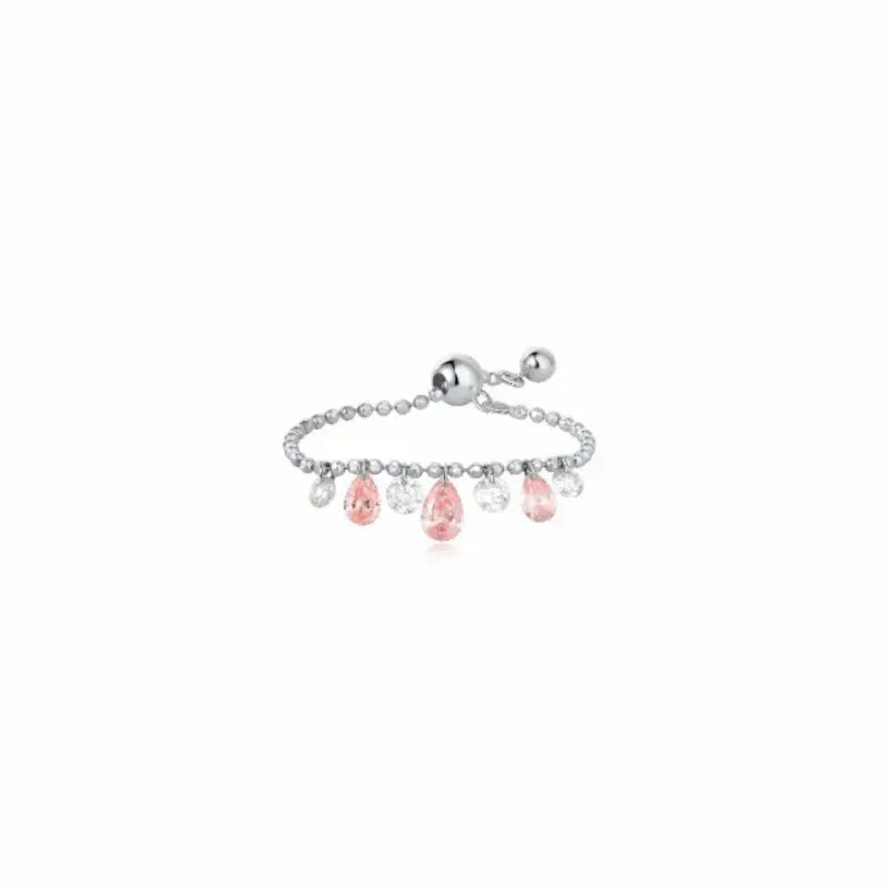 LTM & CO. Seven Drilled Pink & White Diamond Beaded Ring from the Radiant Drift collection. Features seven floating lab-grown diamonds (pink and white) laser-drilled onto a textured 18K solid gold beaded band. A rhythmic, architectural design featuring setting-free diamonds for maximum sparkle and modern, sustainable elegance.