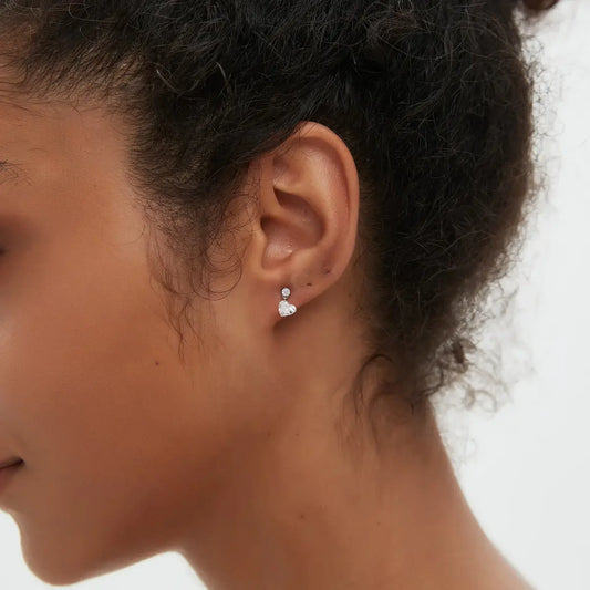 Close-up of Heart Floating Lab Grown Diamond Dangle Threaded Stud Earring in 18K solid gold, highlighting 0.5ct heart diamond and floating dangle structure with round accent.