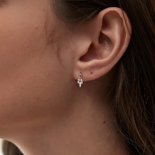 Macro view of the seven pink and white lab-grown diamonds. Showcases LTM & CO.'s signature laser-drilling, where diamonds attach directly to the 18K solid gold beaded band without prongs. Highlights the exquisite texture of the gold beads and the brilliant clarity of the setting-free stones. Innovative and sustainable craftsmanship.