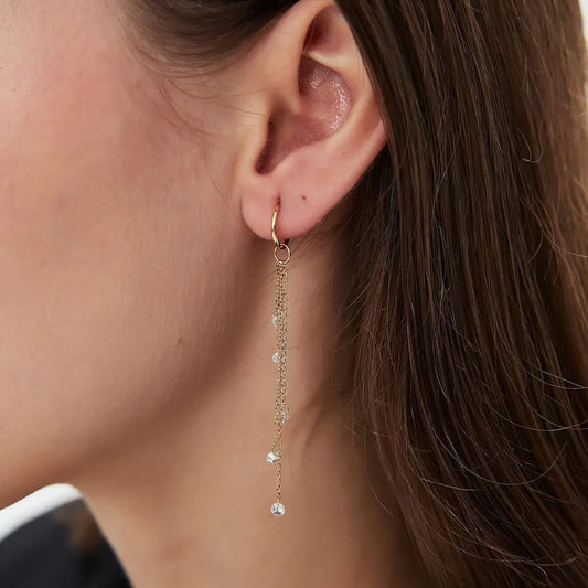 A detailed macro close-up focusing on the master craftsmanship of the Marquise Waterfall Charm. The photograph reveals the precise laser-drilled settings of the five marquise diamonds and the exceptional VVS-VS clarity of each stone. The high-definition image emphasizes the structural beauty and weightless appearance of the design, showcasing the high-polish finish of the 18K solid gold connection. This view is essential for appreciating the innovative architectural precision of LTM & CO.™