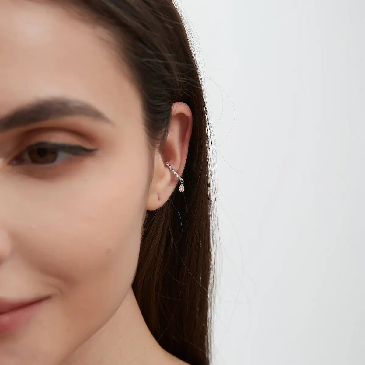 Side view of the Pink Pear Diamond Ear Cuff crafted in solid 18K gold showcasing the adjustable no-piercing cuff structure and floating diamond construction. The lightweight sculptural design is engineered for comfortable daily wear and refined modern styling.