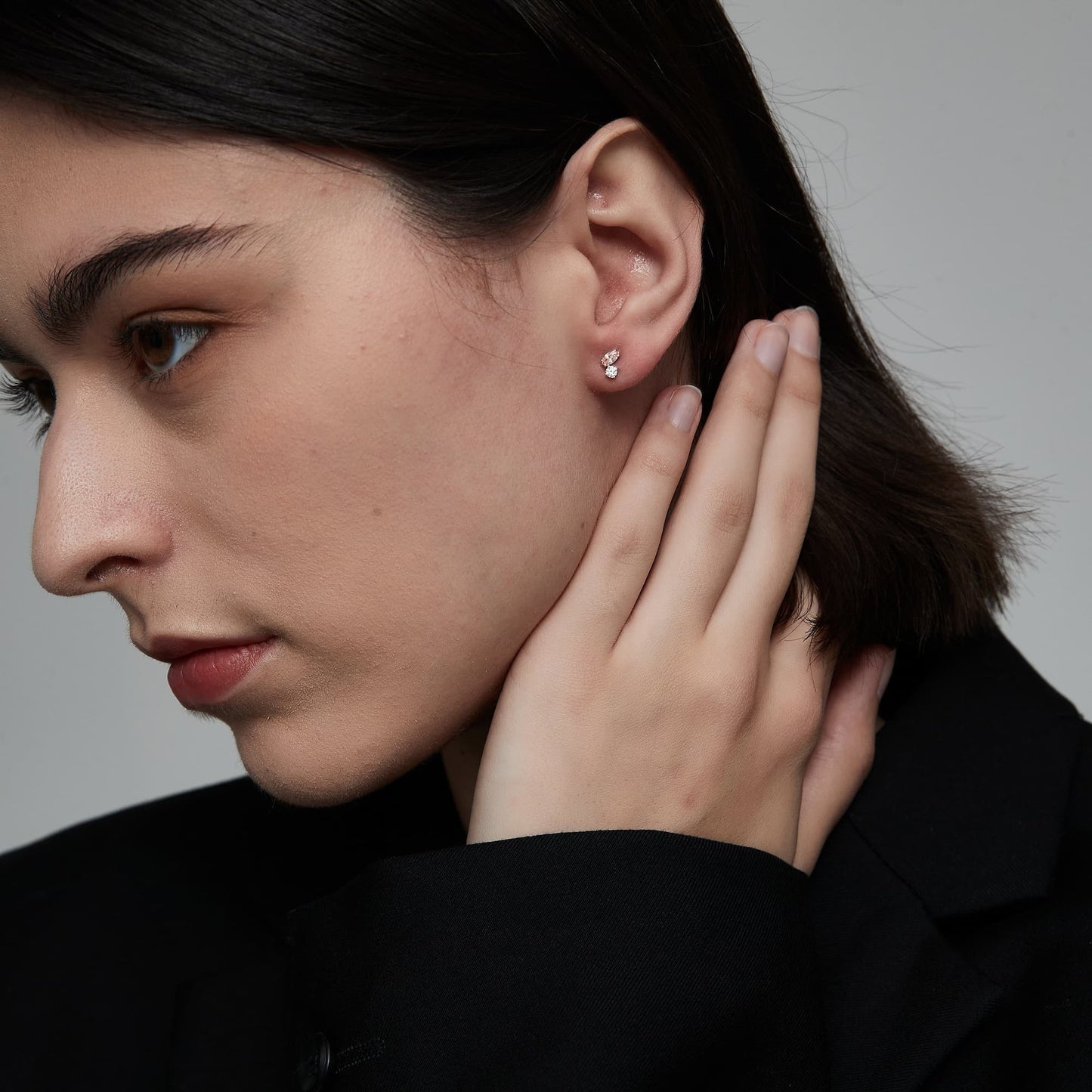 Side profile showing the secure threaded screw back and flat-back design.