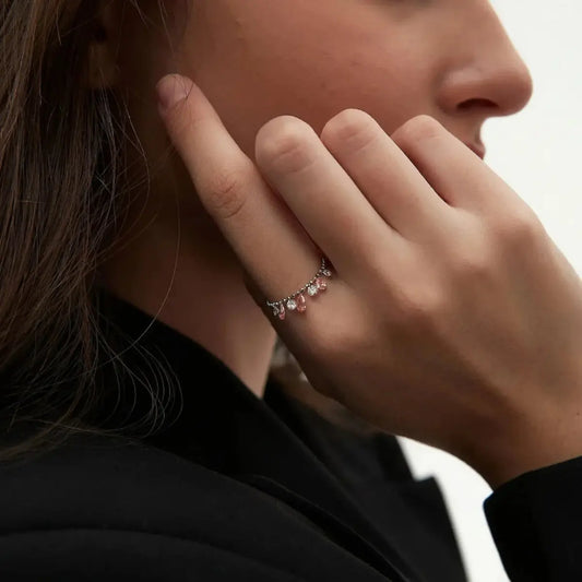 Macro view of the seven pink and white lab-grown diamonds. Showcases LTM & CO.'s signature laser-drilling, where diamonds attach directly to the 18K solid gold beaded band without prongs. Highlights the exquisite texture of the gold beads and the brilliant clarity of the setting-free stones. Innovative and sustainable craftsmanship.