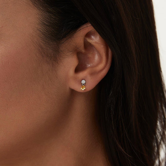 Detail of the 0.1ct white round and 0.2ct yellow marquise diamond in 18K gold.