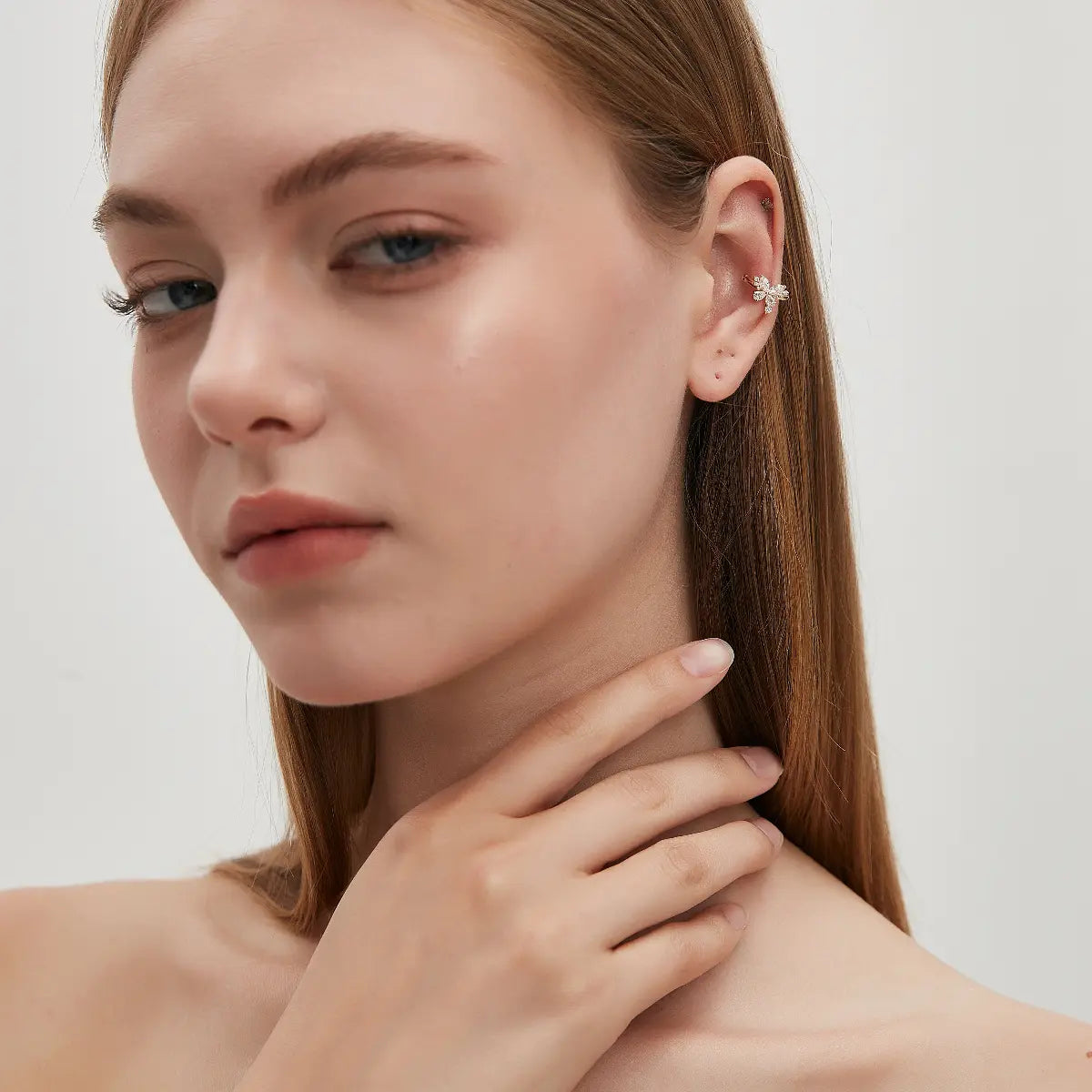 Side view of the Butterfly Diamond Ear Cuff in 18K solid gold, showing the structure of the no-piercing ear cuff design. Featuring a total of 0.40ct lab-grown white diamonds and a delicate butterfly-inspired silhouette, this single ear cuff is designed for versatile curated ear styling.
