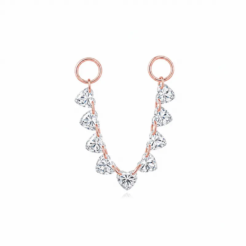 18K solid gold floating heart diamond connecting charm featuring a suspended heart-cut lab-grown diamond in LTM Jewels’ signature Celestial Drift design. The minimalist laser-drilled floating construction creates a luminous weightless appearance designed for modern curated ear styling and everyday luxury wear.