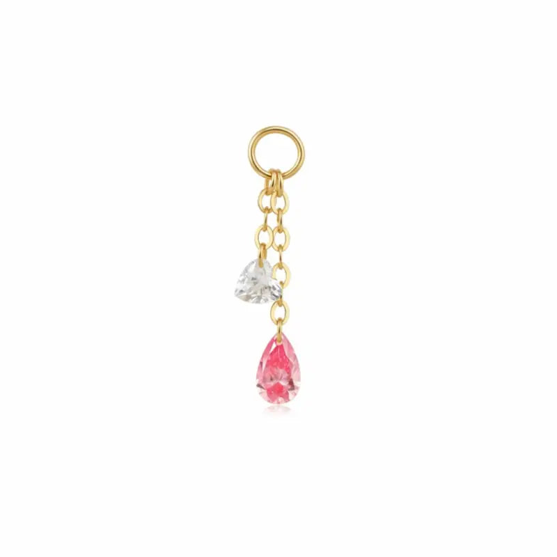 A high-resolution studio photograph of the Pink Pear White Heart Charm from LTM Jewels. This 18K solid gold charm features a unique kinetic design with a laser-drilled 0.10ct white heart-cut diamond paired with a swaying 0.20ct pink pear-shaped lab-grown diamond. The image captures the crystalline purity of the D-E color heart and the delicate rose hues of the pink pear, showcasing the VVS-VS clarity and master craftsmanship of the AU750 gold setting.