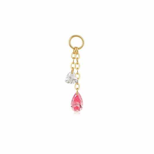 A high-resolution studio photograph of the Pink Pear White Heart Charm from LTM Jewels. This 18K solid gold charm features a unique kinetic design with a laser-drilled 0.10ct white heart-cut diamond paired with a swaying 0.20ct pink pear-shaped lab-grown diamond. The image captures the crystalline purity of the D-E color heart and the delicate rose hues of the pink pear, showcasing the VVS-VS clarity and master craftsmanship of the AU750 gold setting.