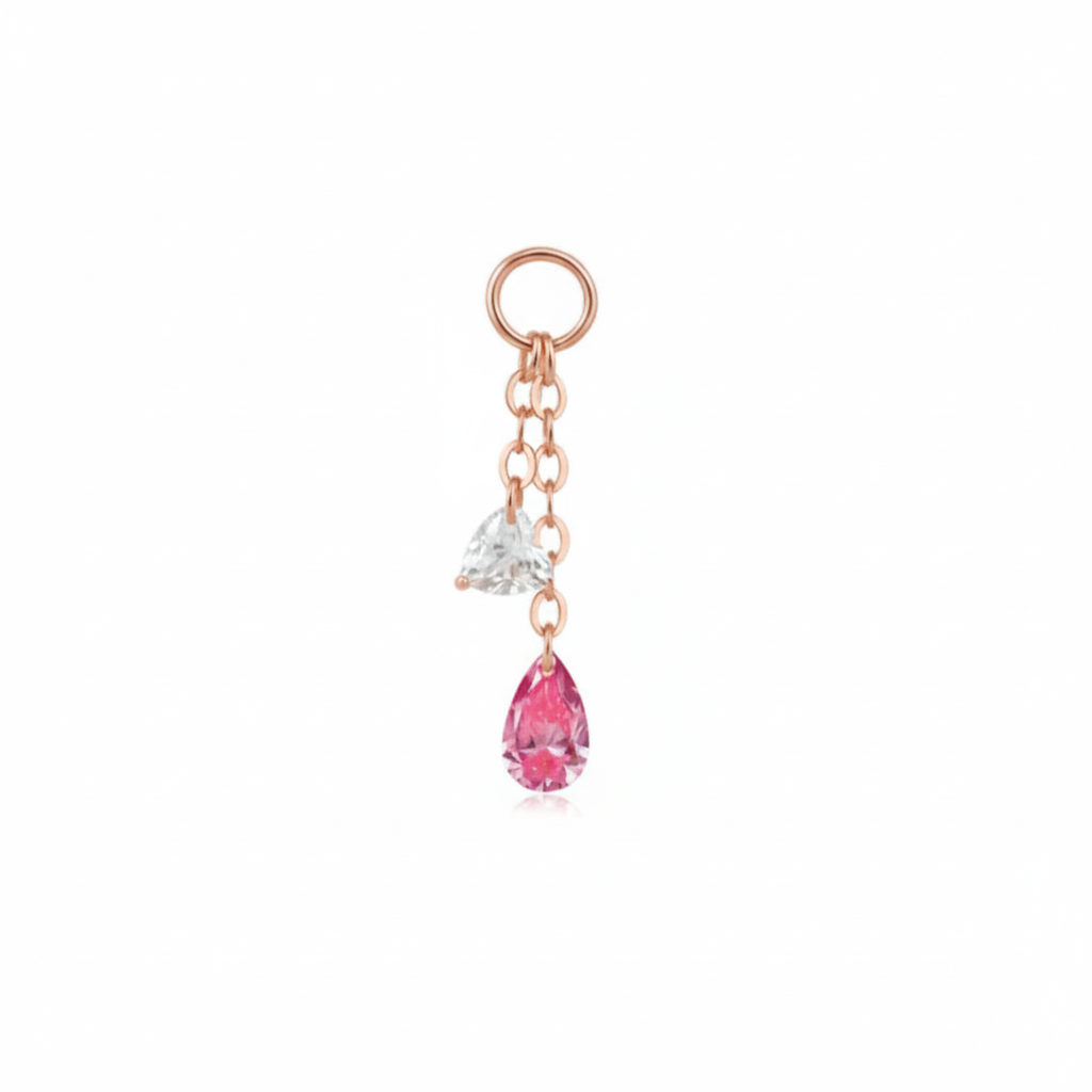 Gold keychain with a teardrop-shaped pink gem and clear gem on a white background in rose gold.