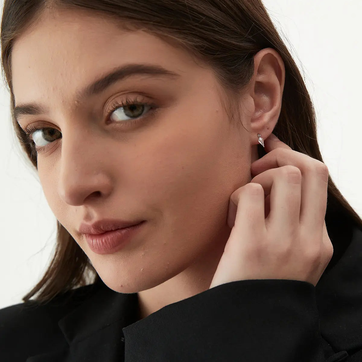 Kite Threaded Dangle Stud worn on the ear featuring a floating kite-shaped lab-grown diamond crafted in solid 18K gold. The lightweight sculptural geometric silhouette creates modern curated ear styling with architectural elegance and cinematic brilliance.