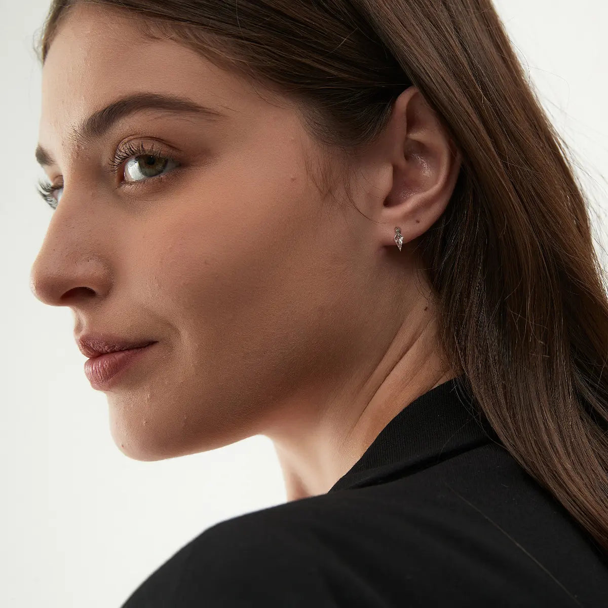 Side view of the Kite Threaded Dangle Stud crafted in solid 18K gold showcasing the secure threaded flat-back structure and floating kite diamond construction. The lightweight sculptural geometric design is engineered for comfortable 24/7 wear and refined contemporary styling.