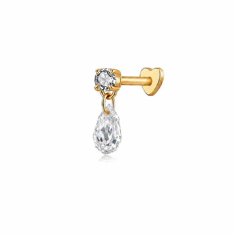 A high-resolution photo of the Step Cut Pear Round Threaded Dangle Stud from LTM & CO.™. Features a brilliant round diamond connected to a hanging step-cut pear diamond in 18K solid gold (AU750). The image highlights the "hall-of-mirrors" effect of the step-cut gemstone and the crystalline VVS-VS clarity of the D-E color diamonds, showcasing the geometric precision of the Architectural Rhythm collection.