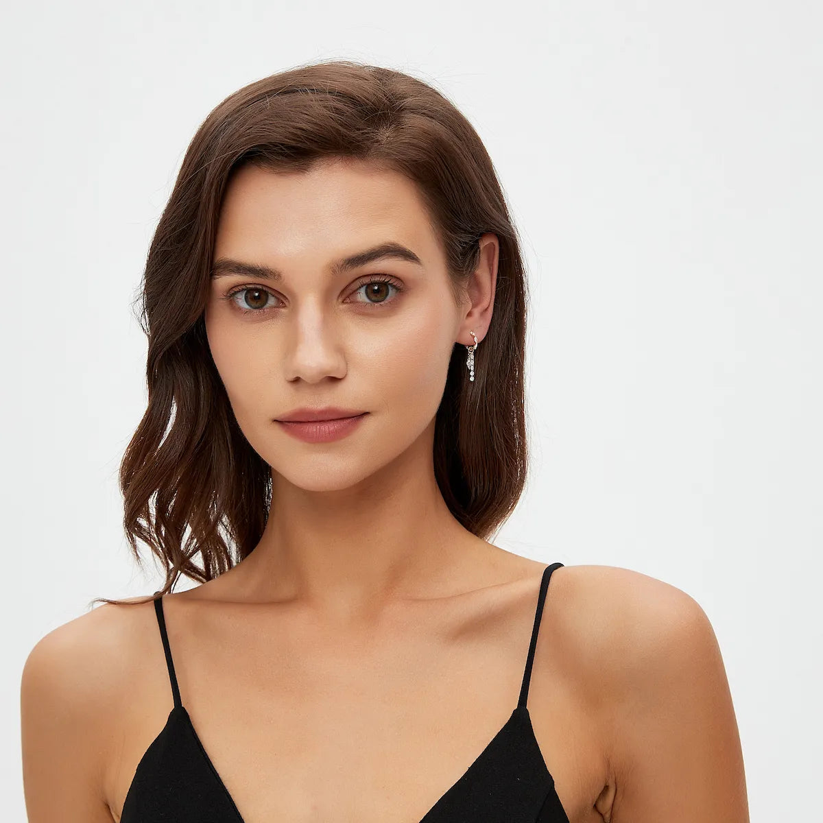 Model wearing the asymmetric kite and round diamond connecting charm from LTM Jewels’ Celestial Drift collection. The cascading floating diamond composition creates dramatic movement, editorial elegance, and refined modern fine jewelry styling designed for elevated everyday luxury wear.