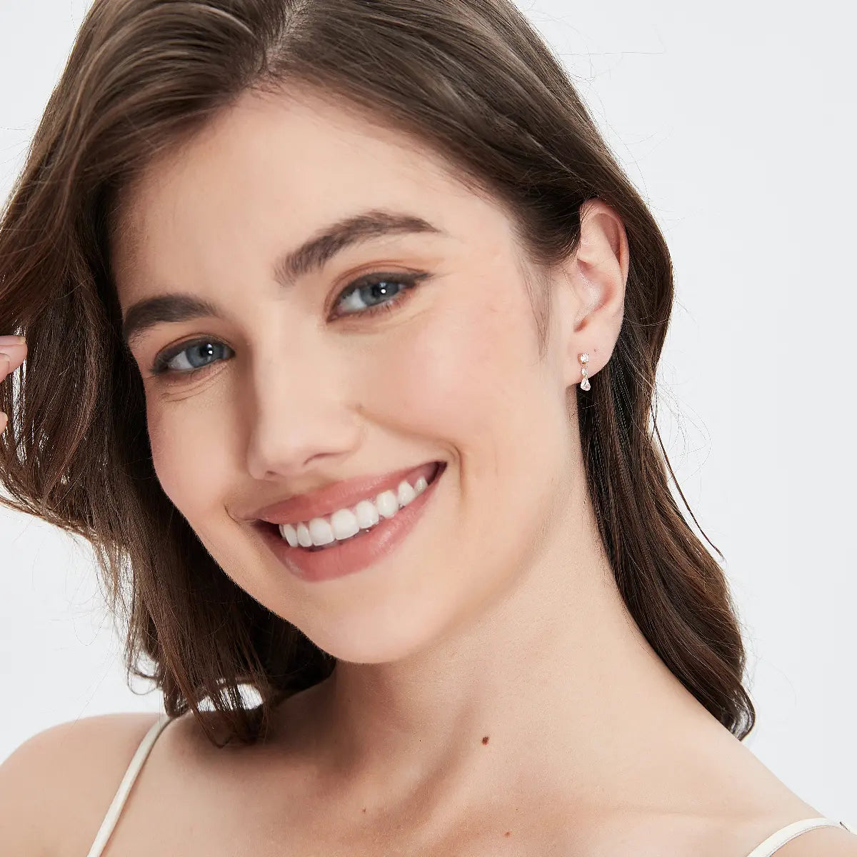 Model wearing the Pink Heart Floating Diamond Stud from the Eternal Radiance collection. The floating pink heart diamond and brilliant white accents create romantic sparkle, feminine elegance, and cinematic luxury styling suitable for both everyday wear and special occasions.