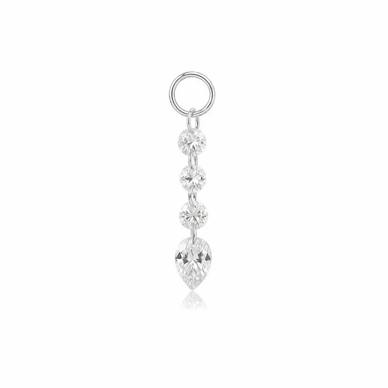 A luxurious 18K solid gold Pear Trio Round Diamond Charm from the LTM Jewels Celestial Drift collection. This exquisite jewelry charm features three pear-cut lab-grown diamonds and a brilliant round diamond in a star-like cluster setting. Designed for modular ear stacks, this 18K gold charm showcases VVS-VS clarity and D-E color diamonds, offering a sustainable yet high-fashion aesthetic for personalized earring curations and luxury gifting.
