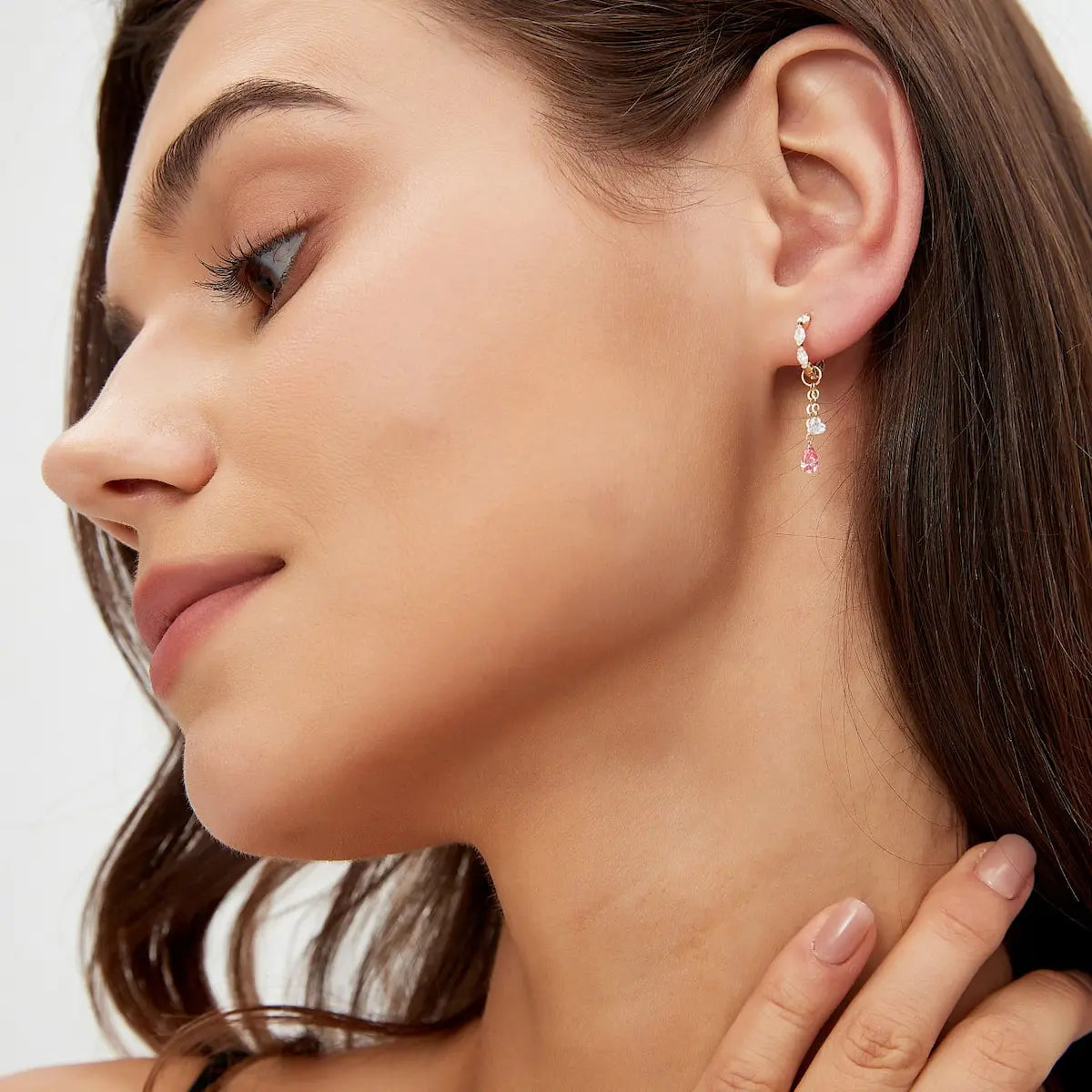 A technical side profile view of the 18K solid gold Pink Pear White Heart Charm. This image highlights the structural integrity of the modular jump ring, designed to slide seamlessly onto hoops or studs. The side perspective emphasizes the thin, elegant profile of the laser-drilled stones and the premium high-polish finish of the AU750 gold link. It showcases the secure and lightweight construction, perfect for permanent 24/7 wear and versatile asymmetric styling.