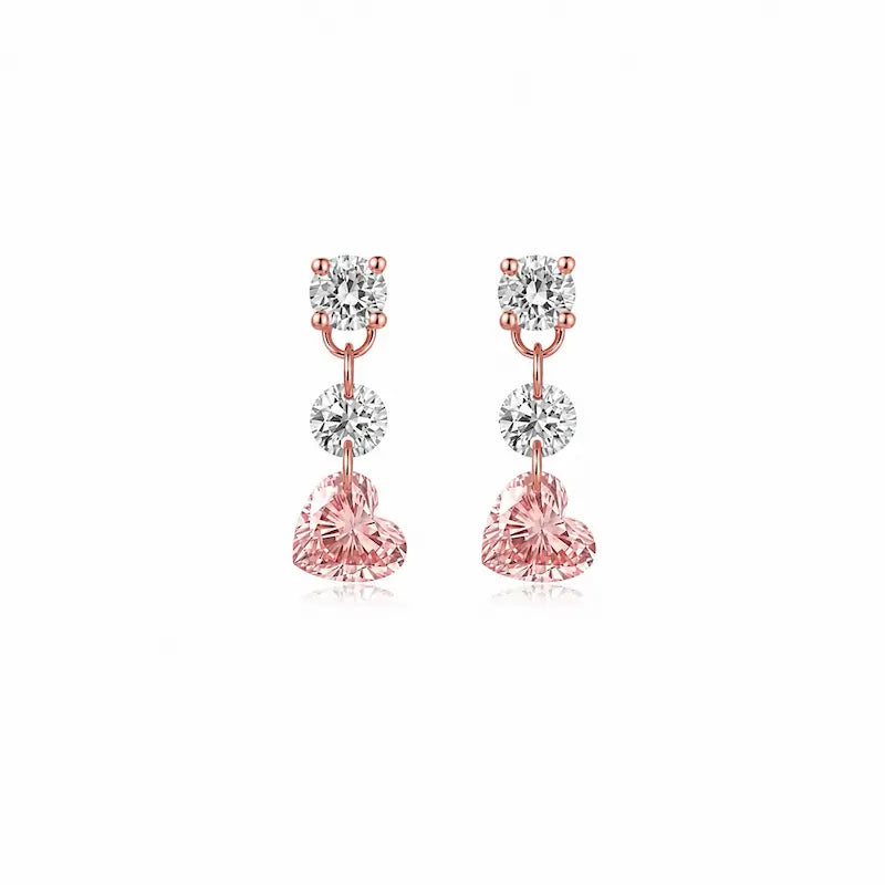 8K solid gold Pink Heart Floating Diamond Stud featuring a suspended 0.20ct lab-grown pink heart-shaped diamond accented by two floating white round diamonds. The weightless floating design maximizes brilliance while creating a romantic modern silhouette inspired by contemporary fine jewelry and eternal elegance.