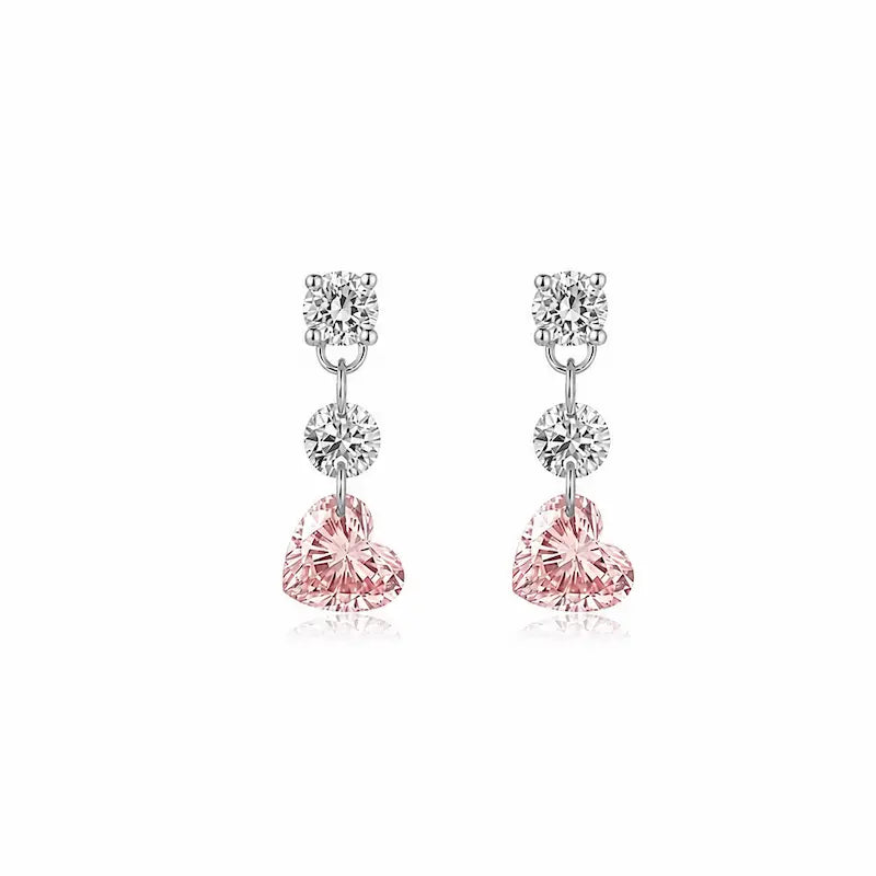 8K solid gold Pink Heart Floating Diamond Stud featuring a suspended 0.20ct lab-grown pink heart-shaped diamond accented by two floating white round diamonds. The weightless floating design maximizes brilliance while creating a romantic modern silhouette inspired by contemporary fine jewelry and eternal elegance.