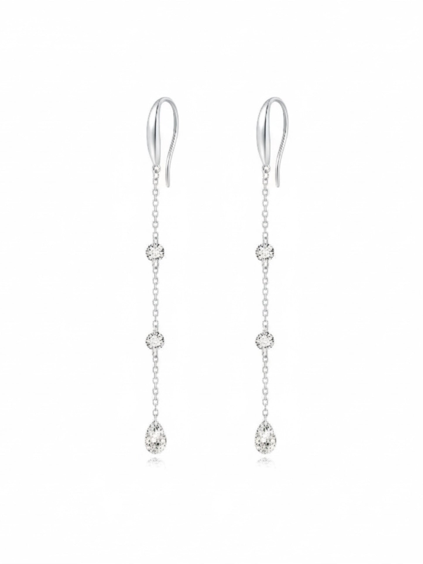 A high-resolution photo of the Triple Diamond Chain Dangle Hoop from LTM Jewels. Showcases 0.40ctw of round and pear diamonds on an 18K solid gold chain, emphasizing its vertical raindrop effect and cinematic sparkle.