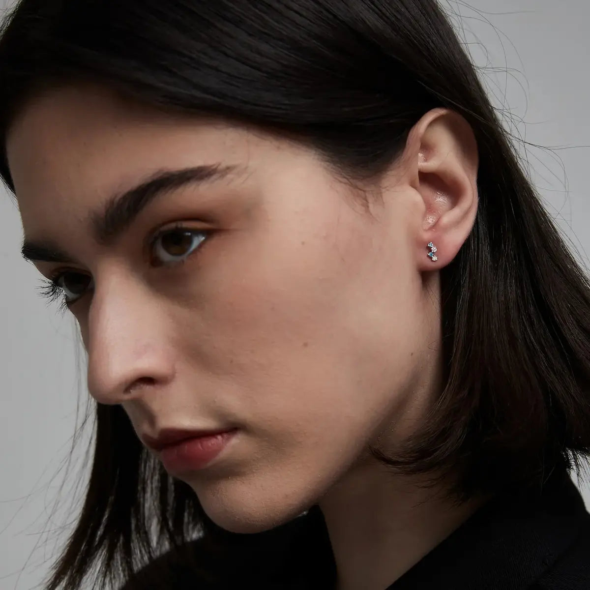 Round Floating Blue & White Lab Diamond Threaded Stud Earring worn on ear in 18K solid gold, showcasing floating diamonds and secure screw-back for everyday wear.