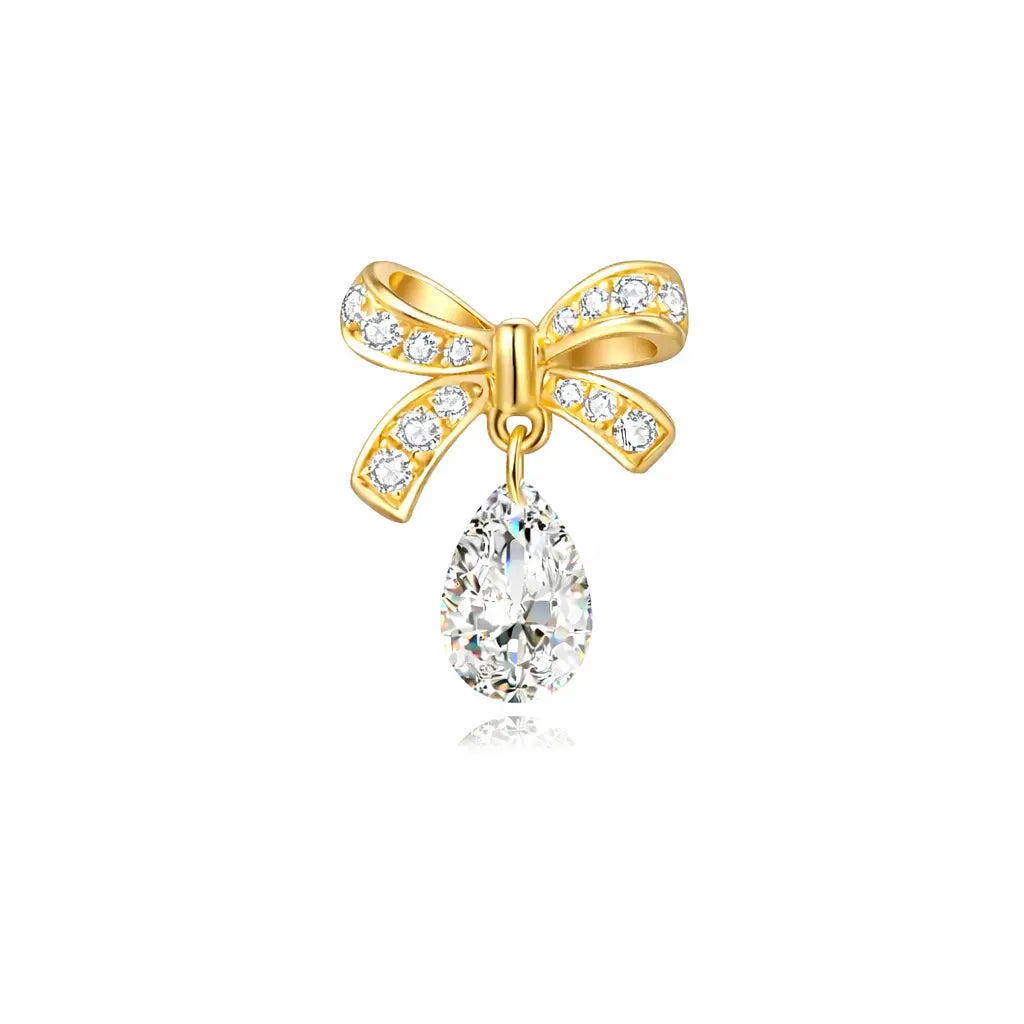 18K solid gold stud with a butterfly bow and dangling pear diamond.