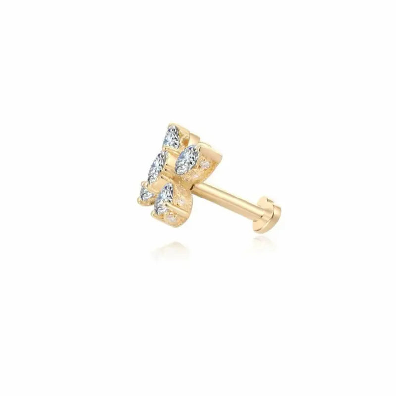 Macro view of the LTM & CO.™ butterfly stud earring. Highlights the intricate faceting of the white marquise-cut diamonds forming the butterfly wings. Showcases the high-polish 18K solid gold setting and the precise alignment of the gemstones. Captures the sparkle and detailed artistry of the Whimsical Flight collection.