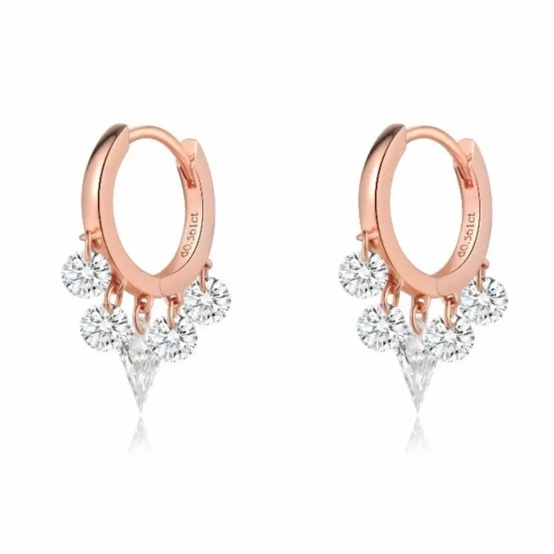 A high-fashion 18K solid gold fringe hoop earring from LTM Jewels, featuring a stunning symmetrical arrangement of five lab-grown diamonds. The design is centered by a modernist laser-drilled kite-cut diamond, flanked by two pairs of brilliant round diamonds that create a rhythmic fringe effect. This 0.55ctw piece from the Celestial Drift collection showcases VVS-VS clarity and D-E color diamonds with a setting-free, floating aesthetic. 