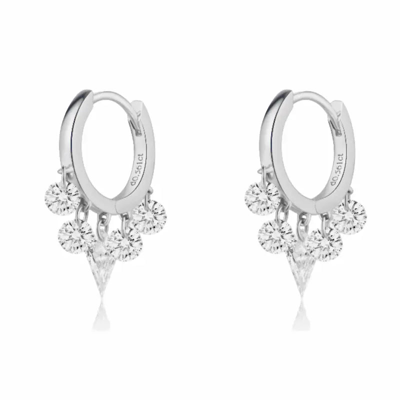 A high-fashion 18K solid gold fringe hoop earring from LTM Jewels, featuring a stunning symmetrical arrangement of five lab-grown diamonds. The design is centered by a modernist laser-drilled kite-cut diamond, flanked by two pairs of brilliant round diamonds that create a rhythmic fringe effect. This 0.55ctw piece from the Celestial Drift collection showcases VVS-VS clarity and D-E color diamonds with a setting-free, floating aesthetic. 