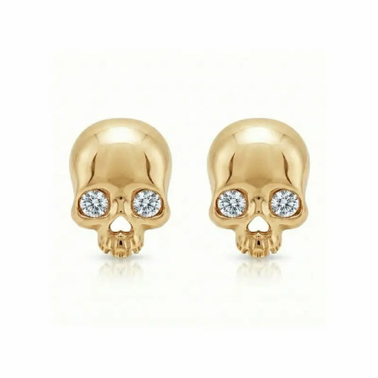 Memento-Mori-Main	A professional high-resolution studio photograph of the Diamond Skull Threaded Stud from the LTM Jewels Memento Mori collection. This 18K solid gold stud is meticulously sculpted with anatomical skull details and accented by a 0.02ct natural round brilliant diamond of VS1 clarity and E color. The image showcases the high-polish AU750 gold finish and the secure threaded screw back design against a clean background, highlighting the blend of rebellion and refinement.
