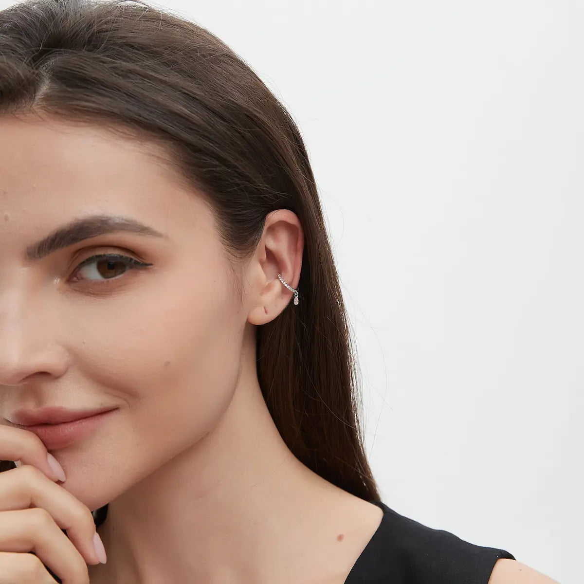 Pink Pear Diamond Ear Cuff worn on the ear featuring a floating pear-shaped pink lab-grown diamond and shimmering white diamond accents. The lightweight adjustable cuff silhouette creates elegant movement and contemporary no-piercing curated ear styling.