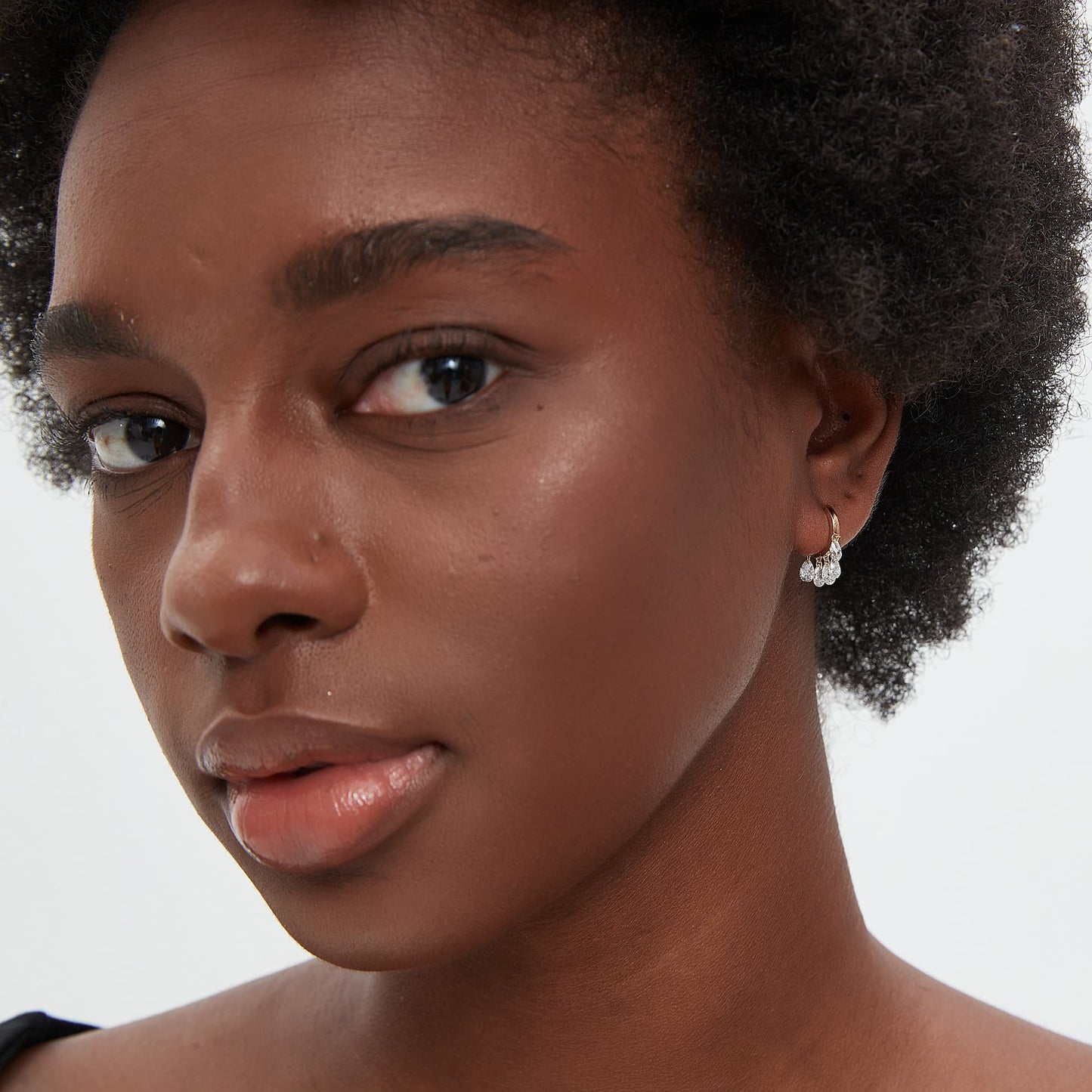 Model wearing The Ethereal Dew pear and chain dangle hoop in 18K solid gold