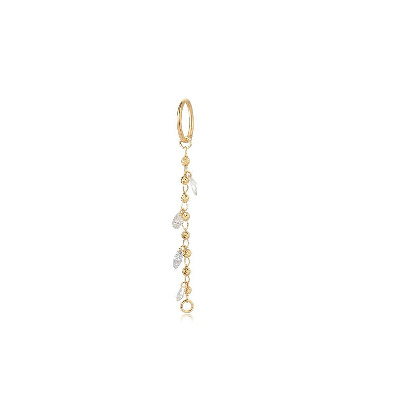 A high-resolution photo of the Gilded Bead & Diamond Dangle Charm in 18K solid gold. Features a sequence of 0.15ctw round diamonds and gold beads from the Celestial Drift collection.