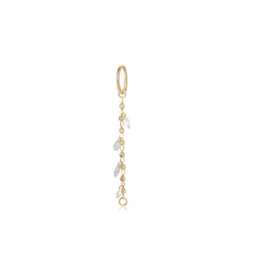 A high-resolution photo of the Gilded Bead & Diamond Dangle Charm in 18K solid gold. Features a sequence of 0.15ctw round diamonds and gold beads from the Celestial Drift collection.