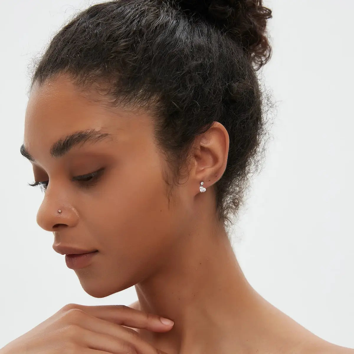 Model wearing Heart Floating Lab Grown Diamond Dangle Threaded Stud Earrings in 18K solid gold by LTM & CO.™, styled as modern fine jewelry with soft romantic brilliance.