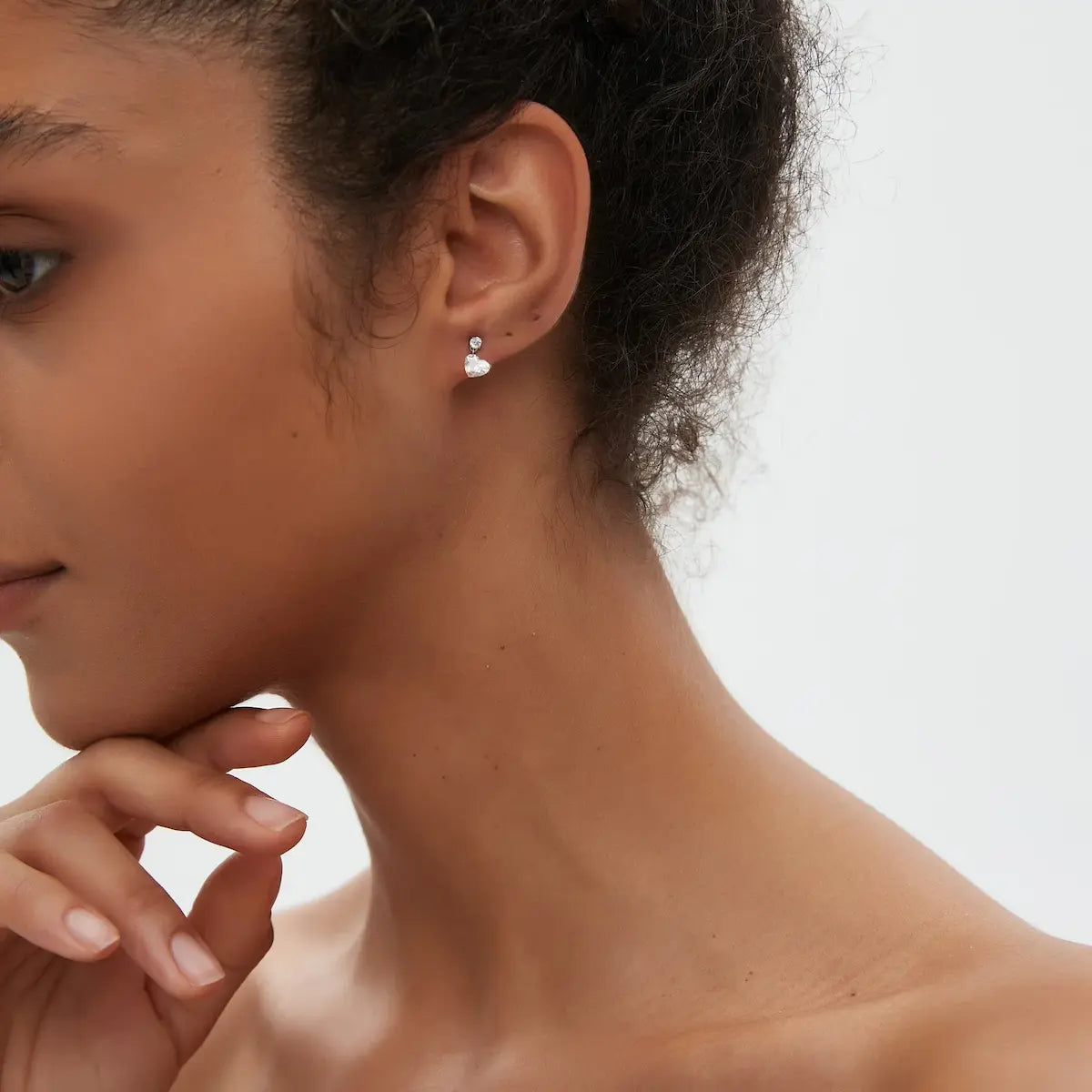 Heart Floating Lab Grown Diamond Dangle Threaded Stud Earring worn on ear in 18K solid gold, showcasing a suspended heart diamond and secure threaded back for everyday wear.