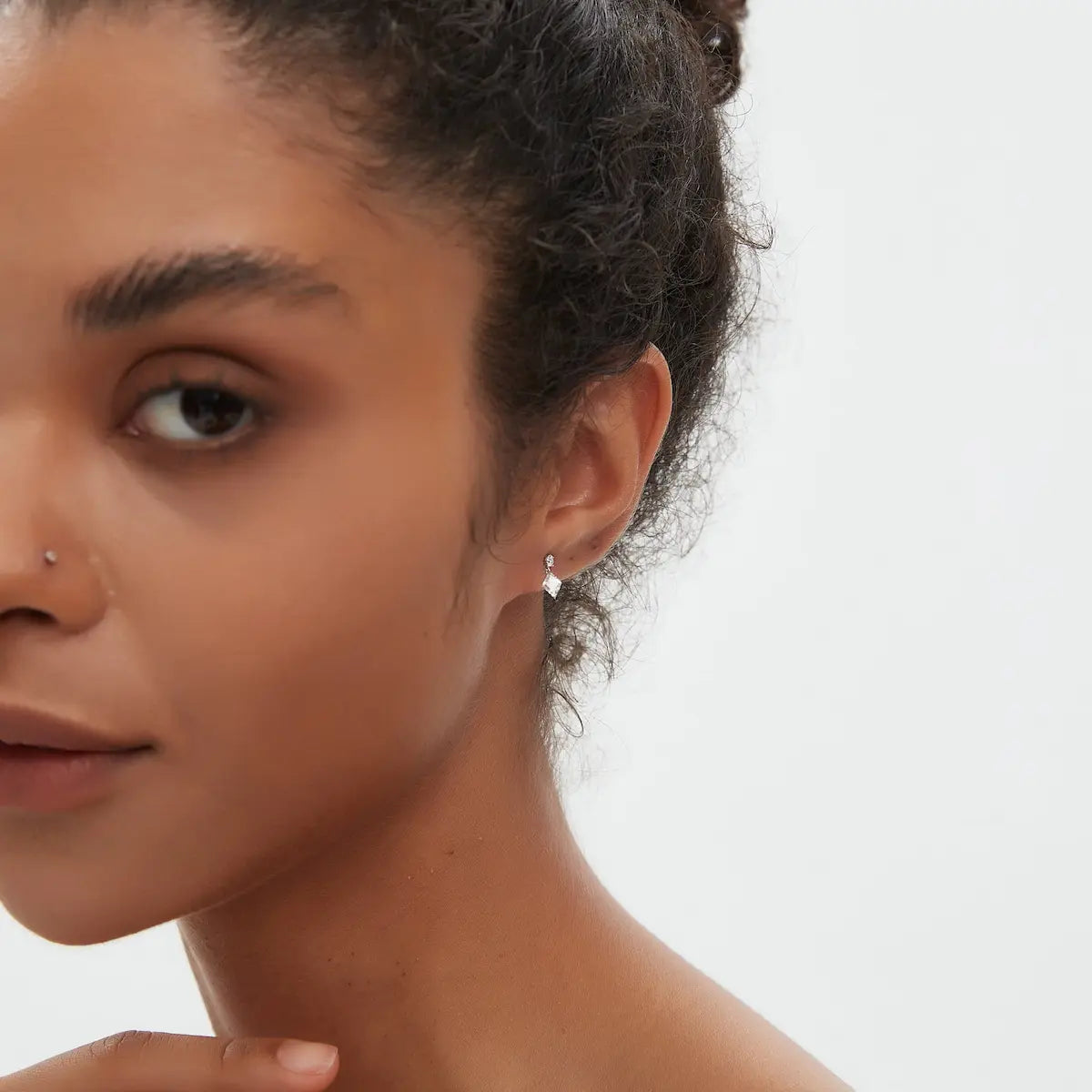 Side view of the Lozenge Dangle Threaded Stud crafted in solid 18K gold showcasing the secure threaded screw-back structure and floating diamond construction. The lightweight sculptural geometric design is engineered for comfortable 24/7 wear and refined contemporary styling.