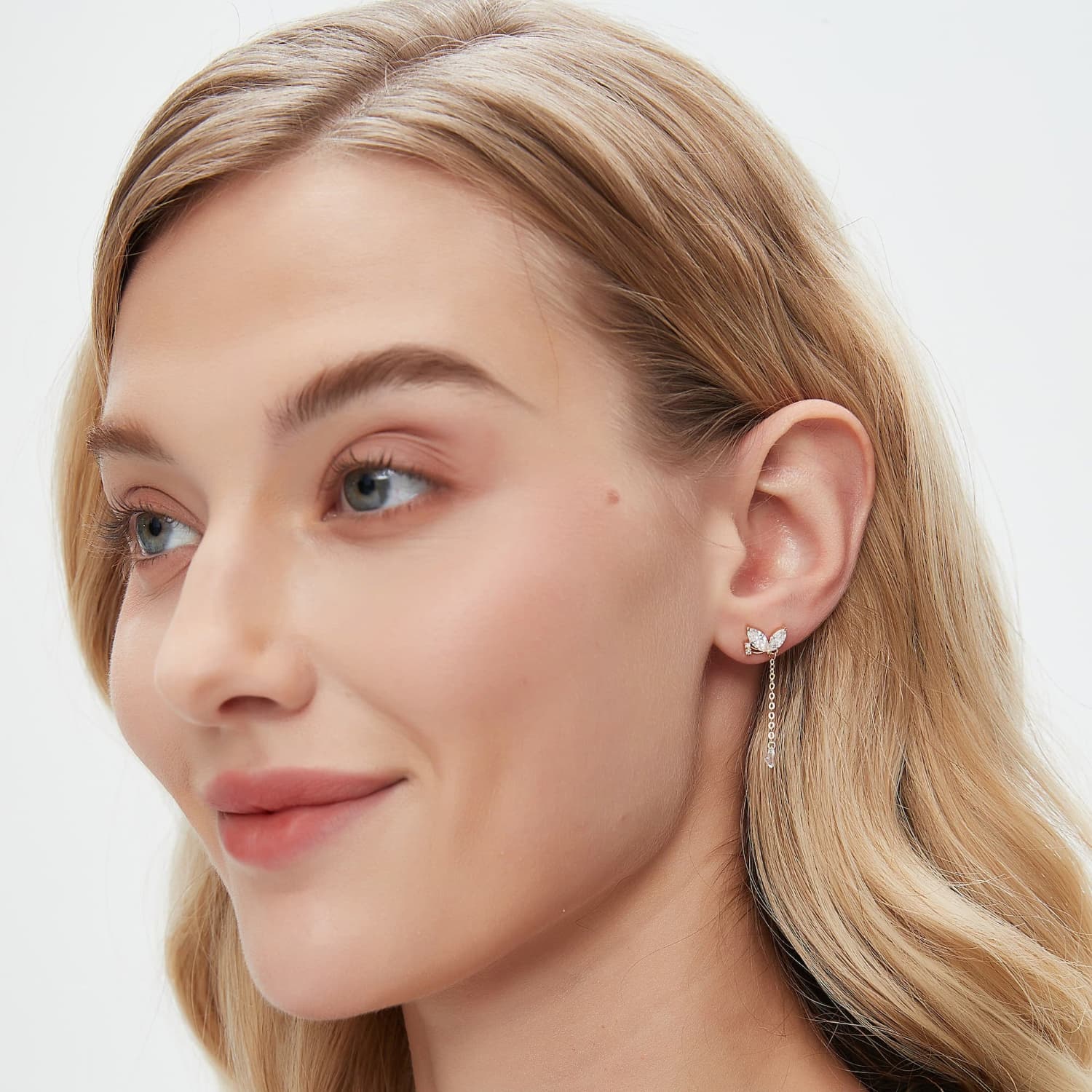 A technical side view showing the structural integrity of the 18K solid gold dangle and the professional threaded screw back, engineered for secure 24/7 comfort and permanent wear.