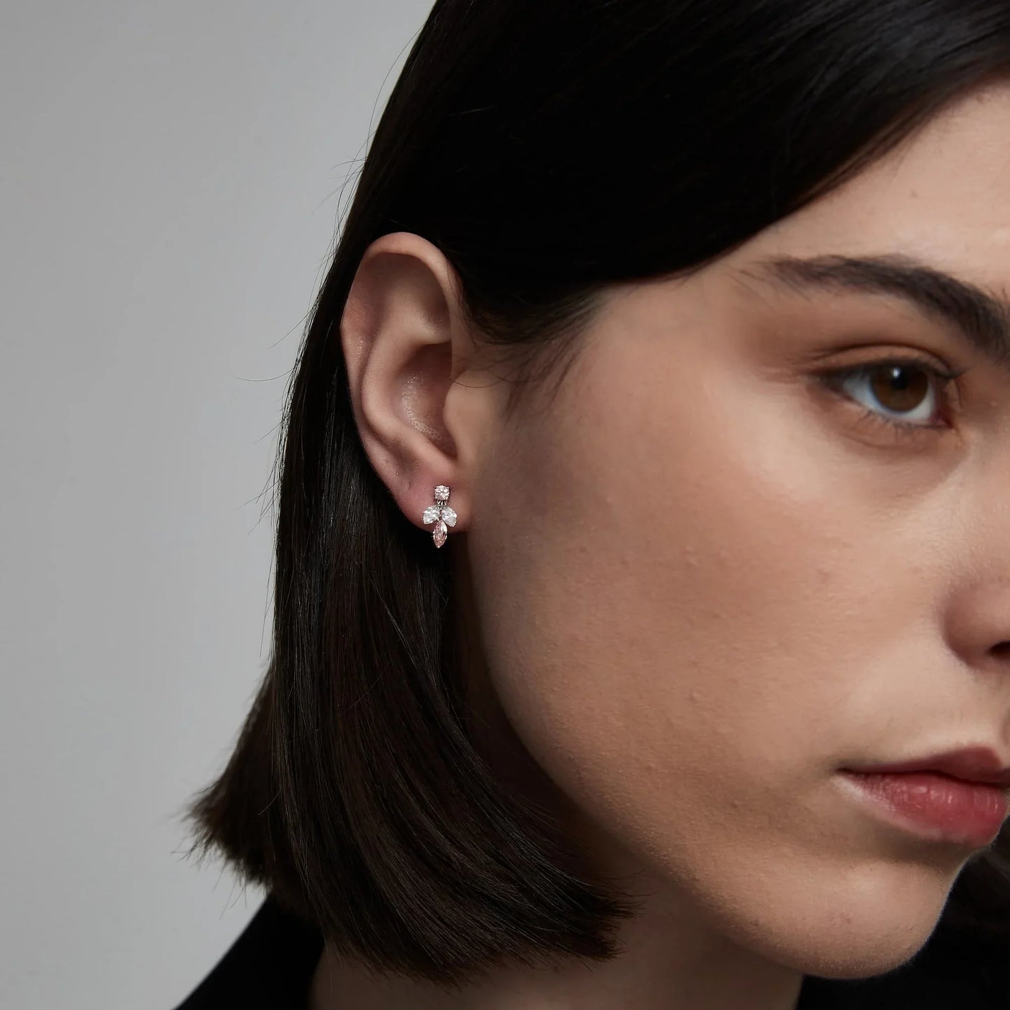 Luxury ear stack styling featuring pink marquise diamond studs