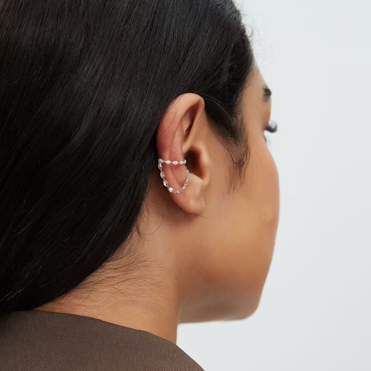 Back view showing the secure grip and fluid diamond chain of the ear cuff
