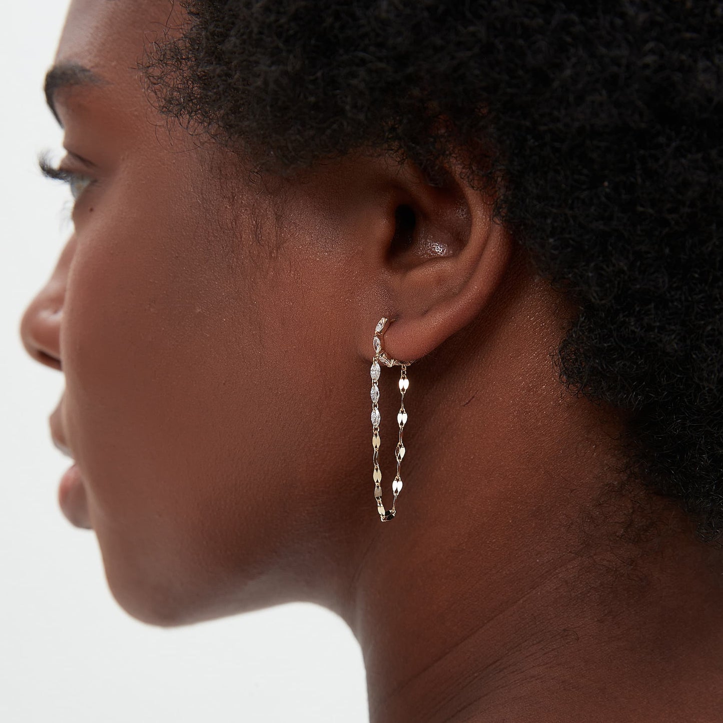 Side view of the 18K solid gold marquise hoop and cascading diamond chain profile