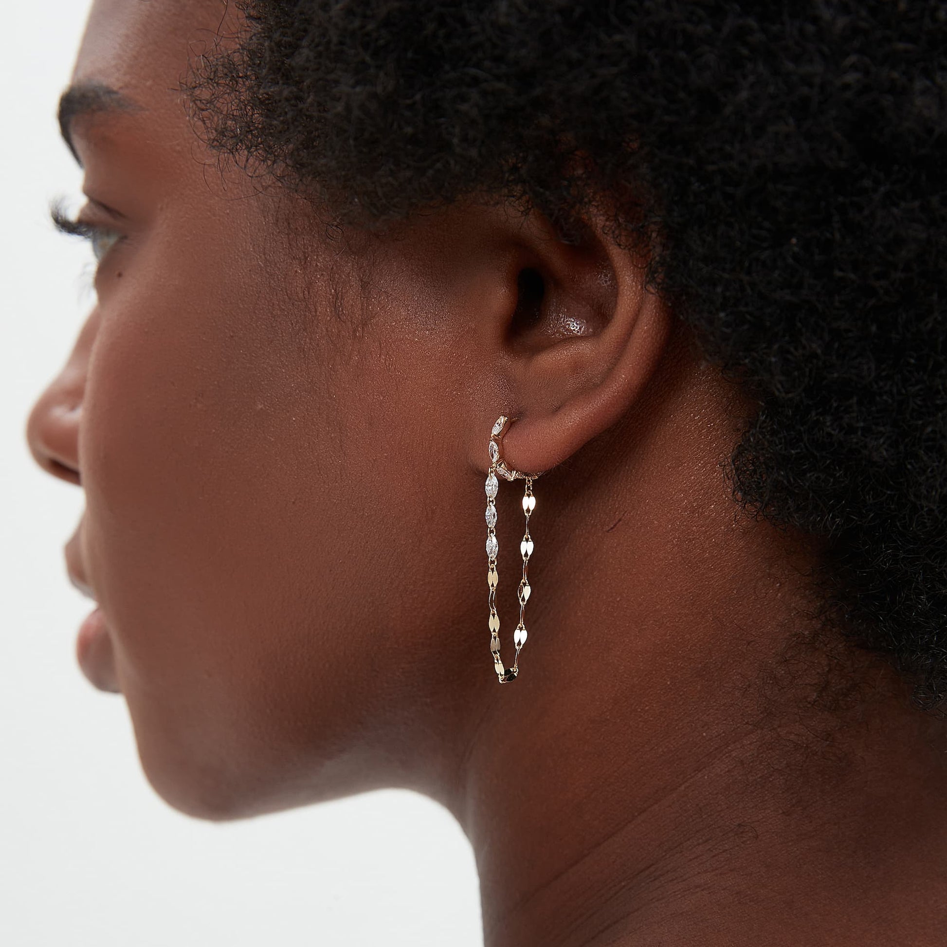 Side view of the 18K solid gold marquise hoop and cascading diamond chain profile