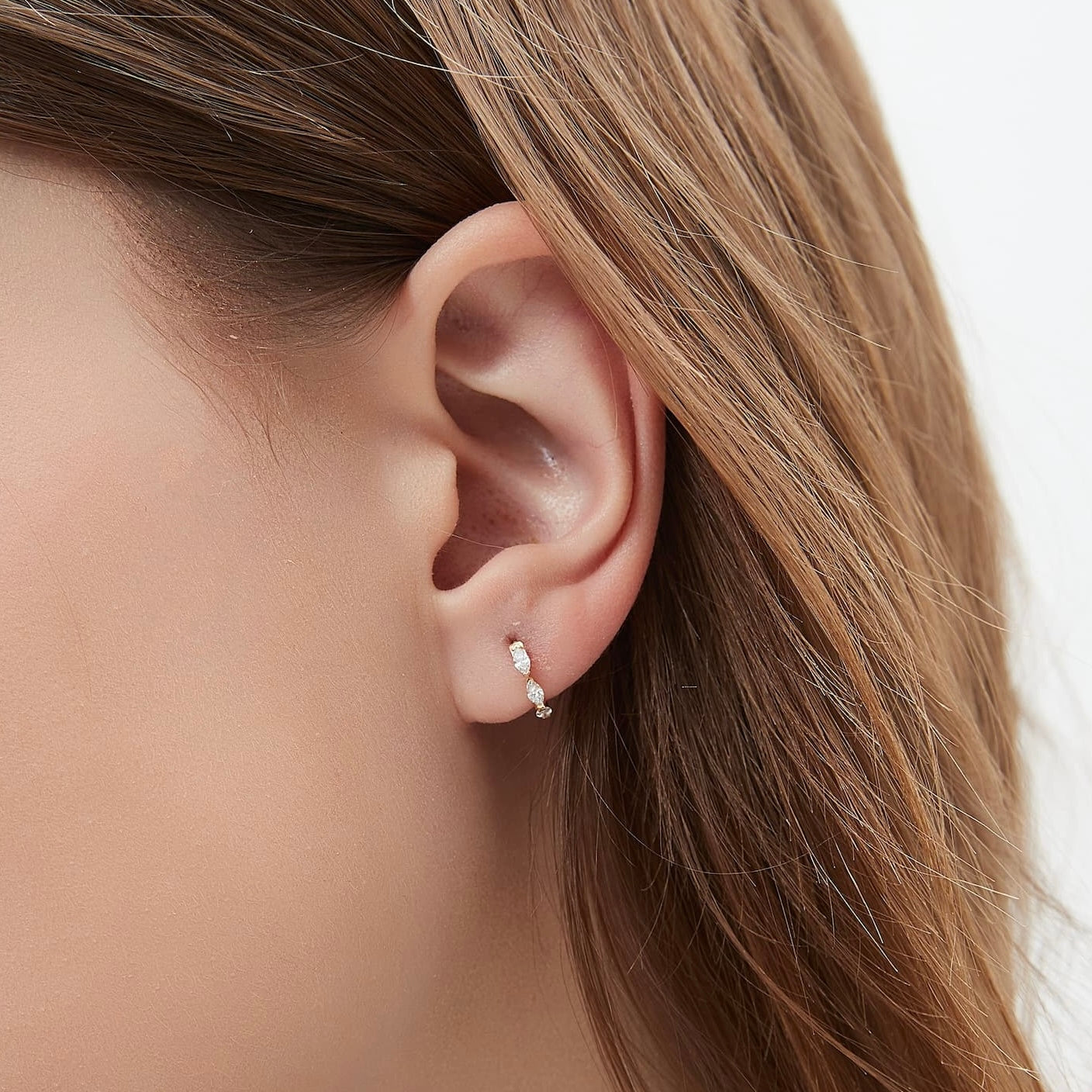 Detail of the multiple marquise-cut diamonds and 18K gold setting.