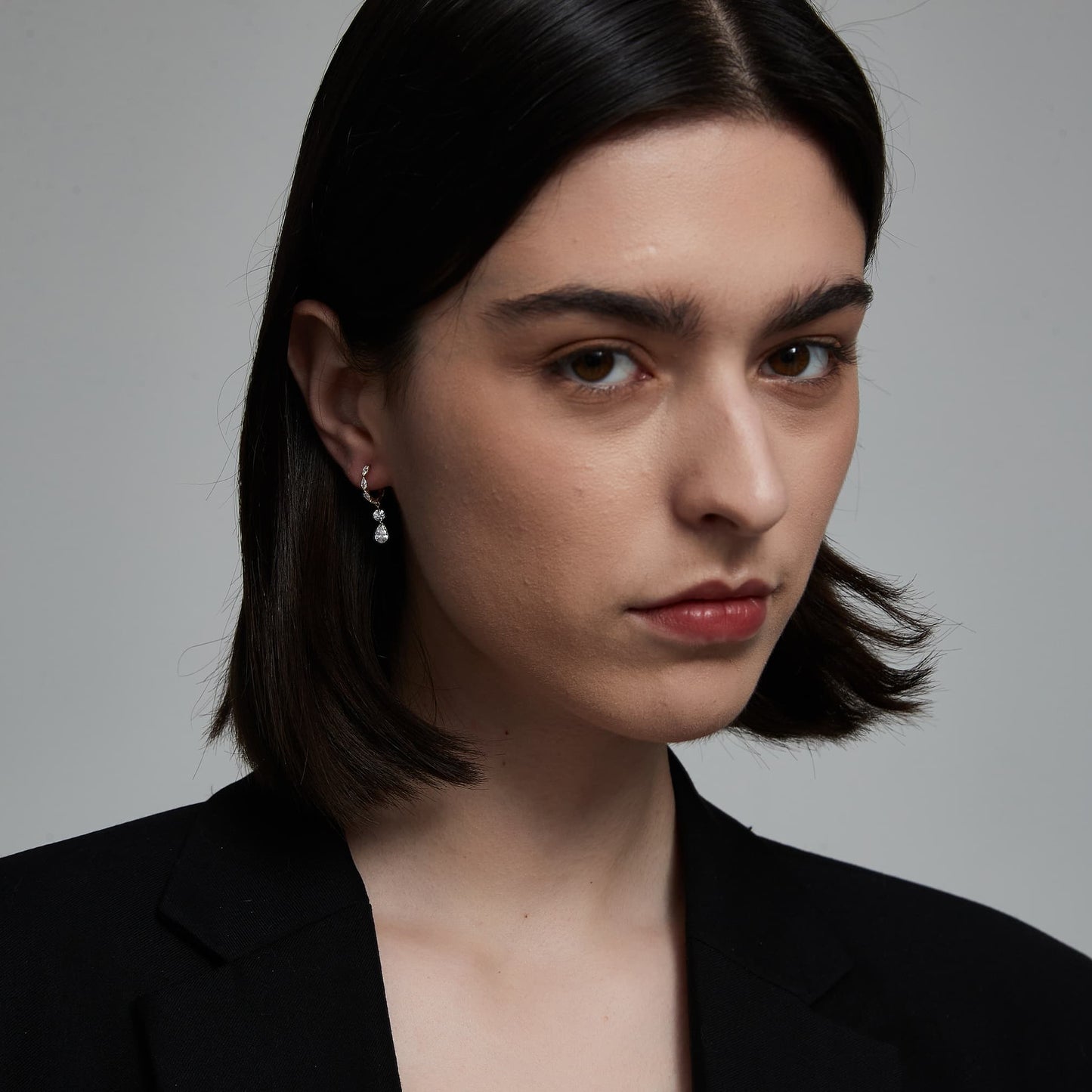 Model wearing the floating brilliance marquise hoop with mixed cut diamond dangle