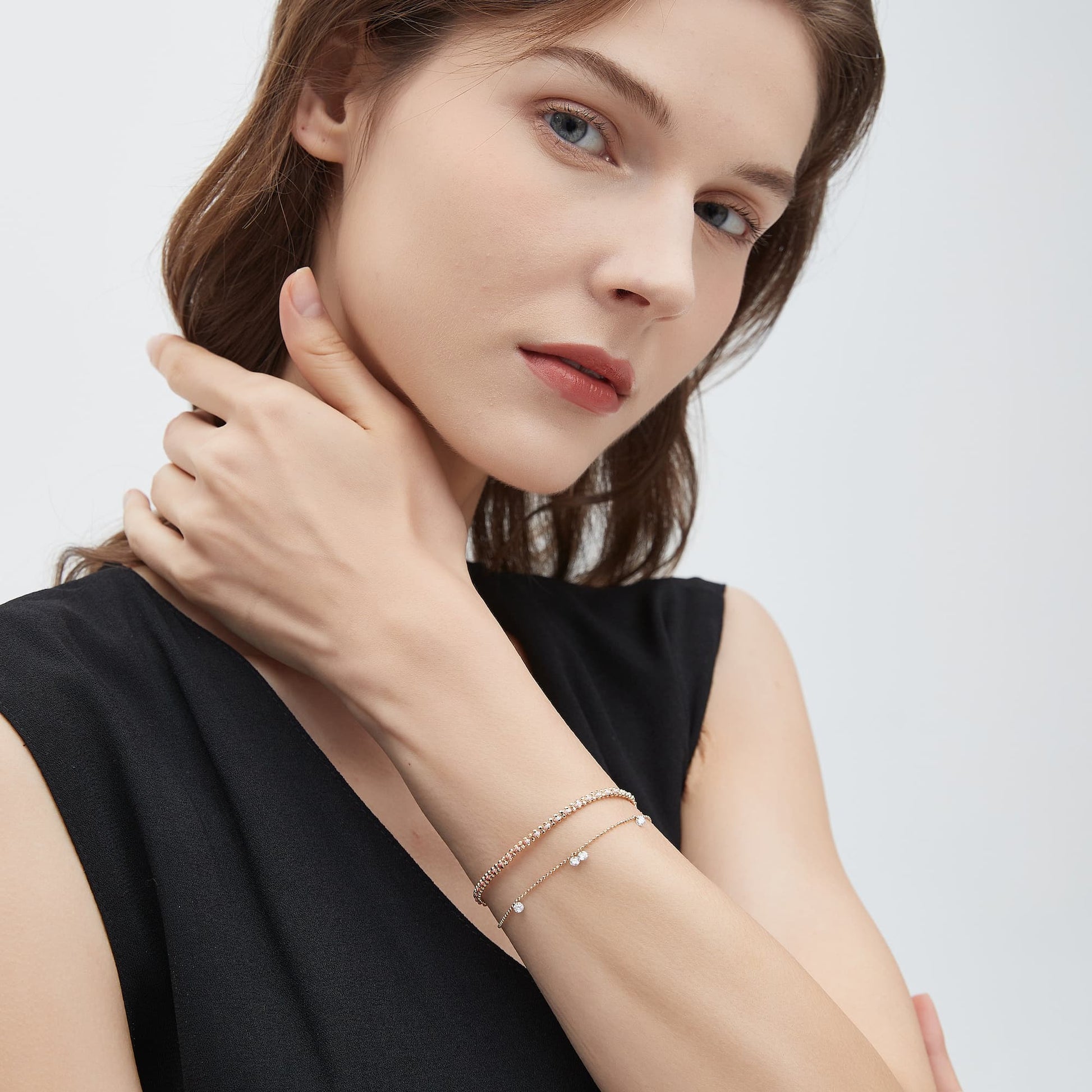 Model wearing the multi-diamond woven bead bracelet for a layered wrist stack.