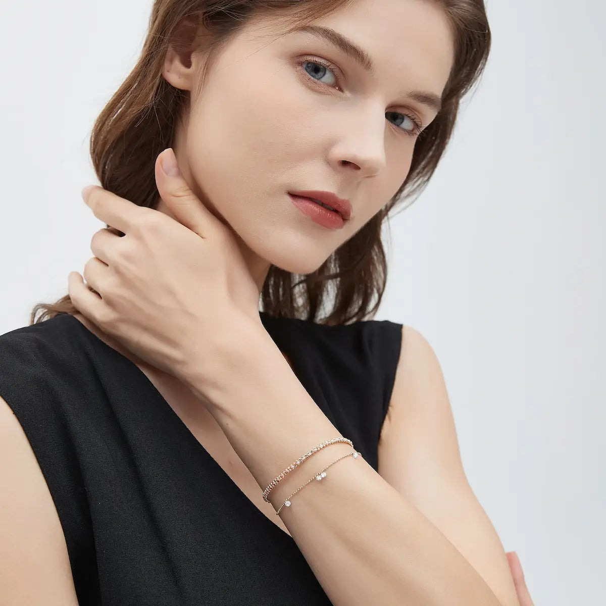 Model wearing the Floating Diamond Rope Bracelet from the Radiant Drift collection. The suspended floating diamonds and shimmering woven gold chain create rhythmic brilliance, fluid movement, and contemporary luxury elegance inspired by editorial fine jewelry styling.
