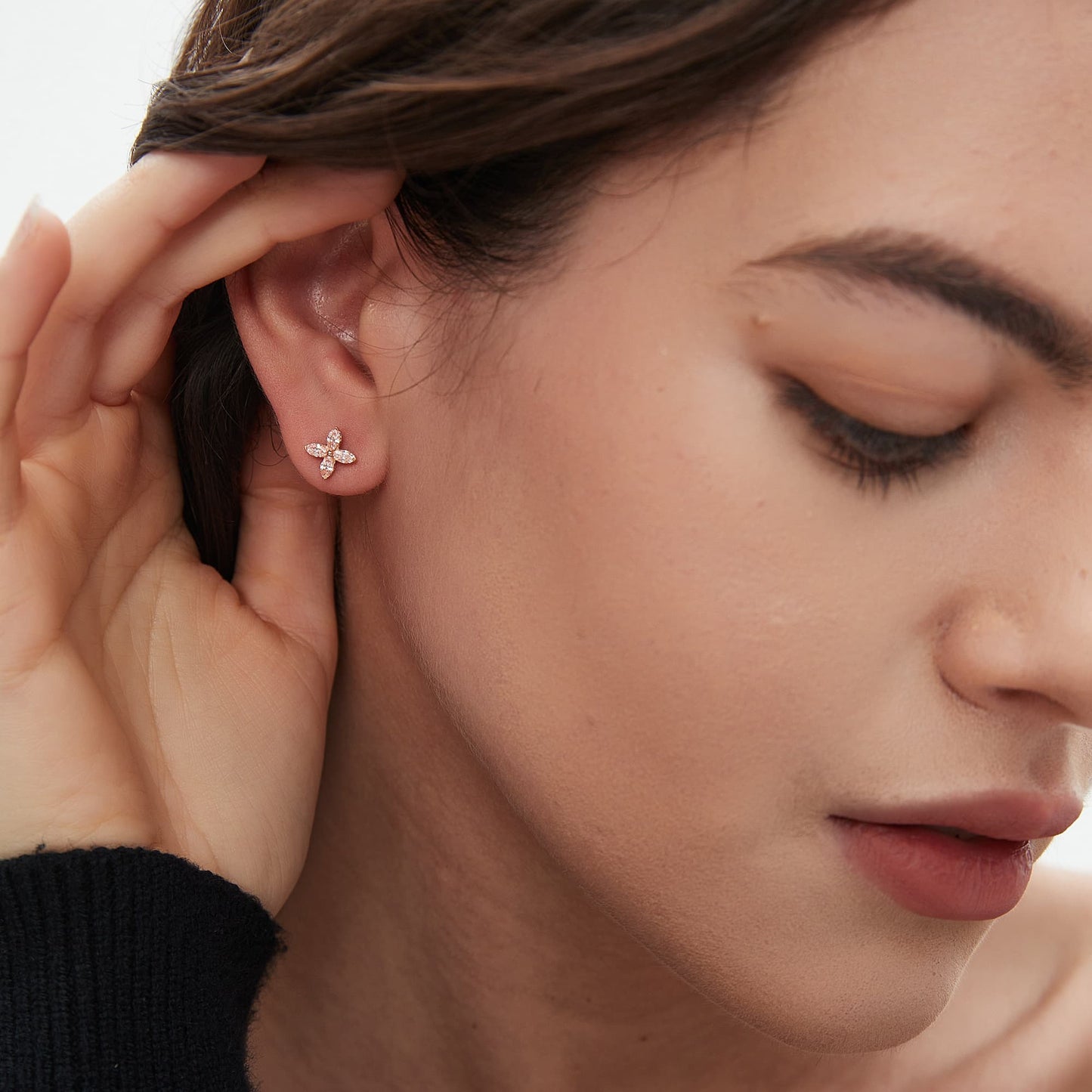 Model wearing the lucky clover pink diamond stud earring in a curated ear stack