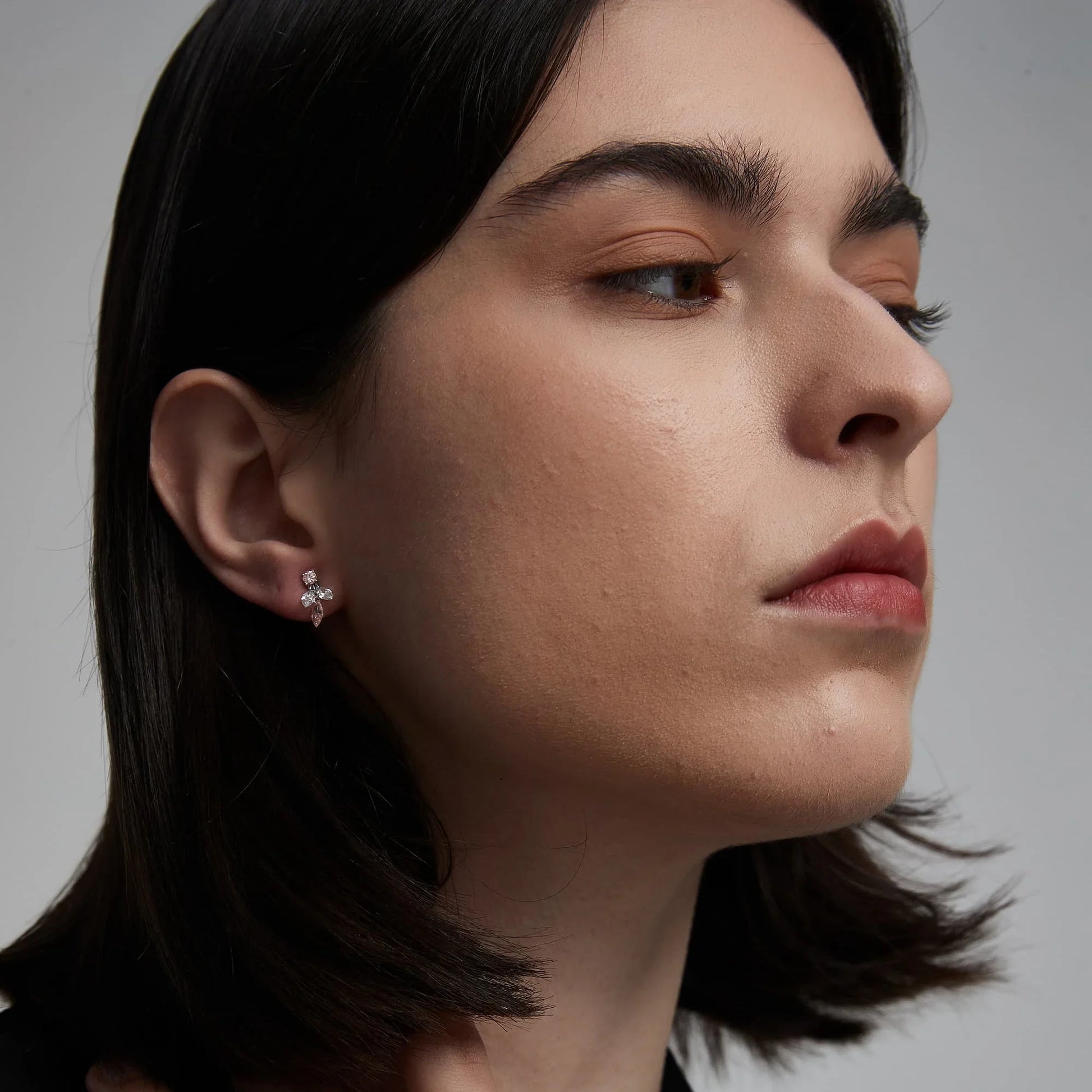 Model wearing The Blush Symphony pink and white diamond stud