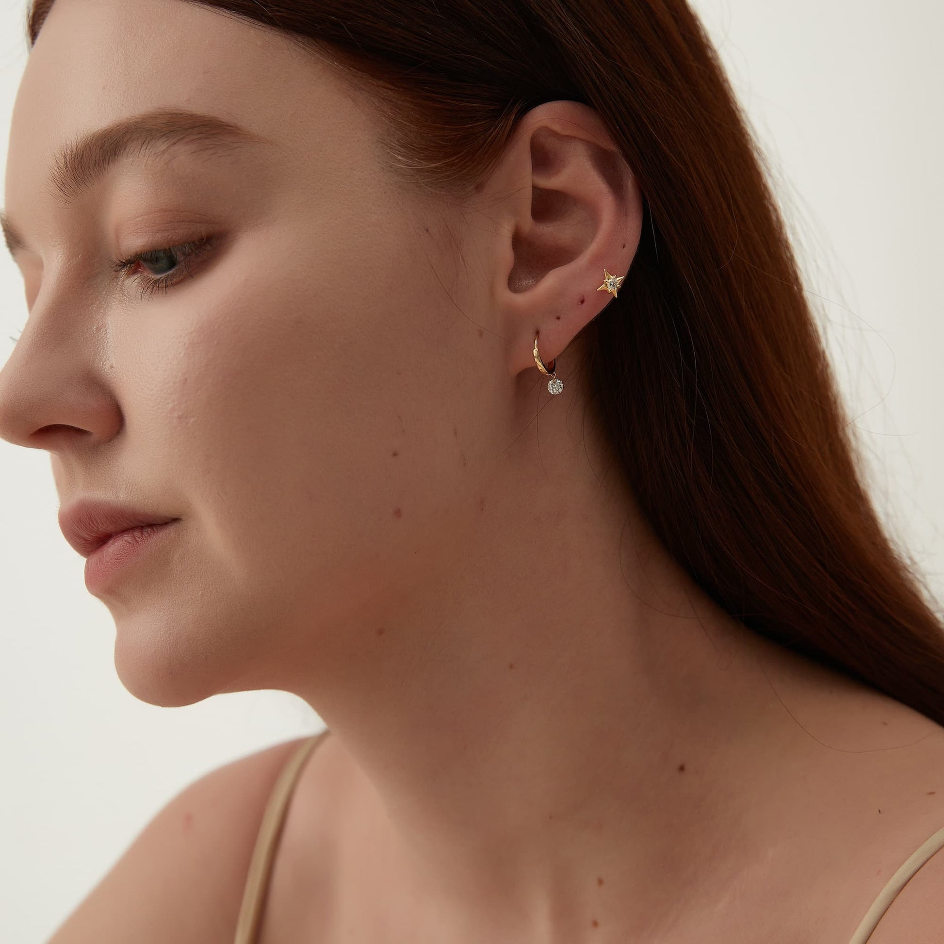 Model wearing Pure Brilliance natural diamond star threaded stud.
